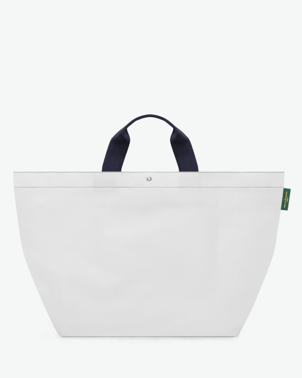 Hervé Chapelier -  - "Packshot of a 2013PP market tote bag
with short polyamide handles and a square bottom.
The bag is made of polyethylene in an extra-large size.
Sac cabas marche a poignees courtes en polyethylene format XL"